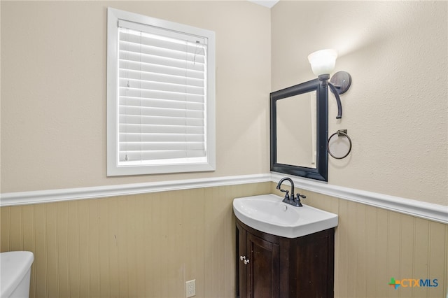 bathroom with vanity and toilet