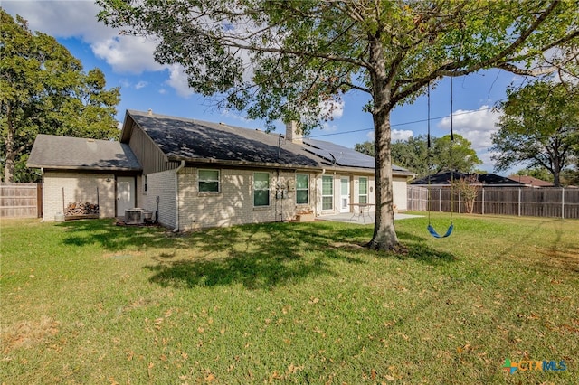 back of house with a yard