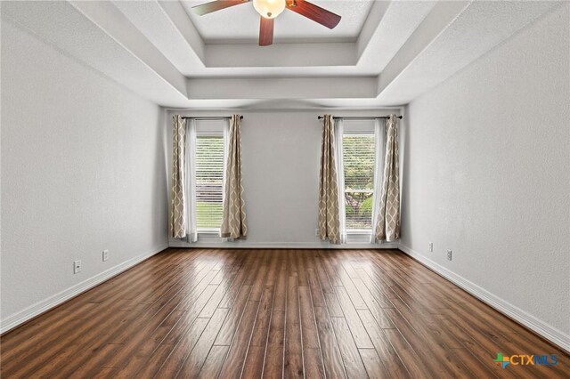 2105 Yak Trl, Harker Heights, TX 76548 - spare room with wood-type flooring, a tray ceiling, ceiling fan, baseboards, and a textured wall