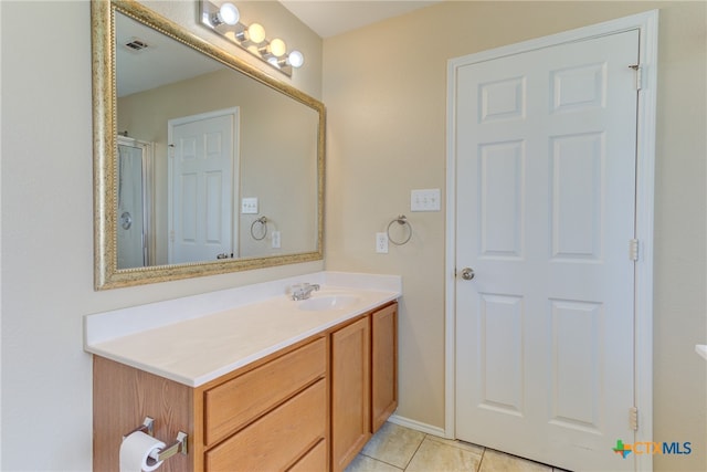 bathroom with vanity and tile patterned floors