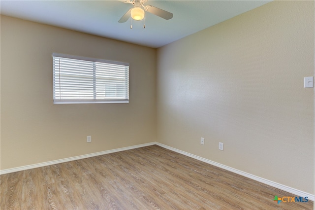 empty room featuring light hardwood / wood-style flooring and ceiling fan