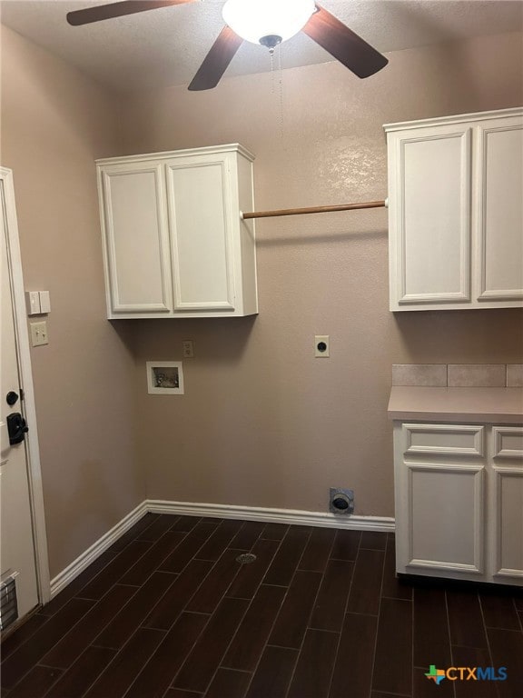 clothes washing area featuring cabinets, washer hookup, dark hardwood / wood-style floors, and hookup for an electric dryer