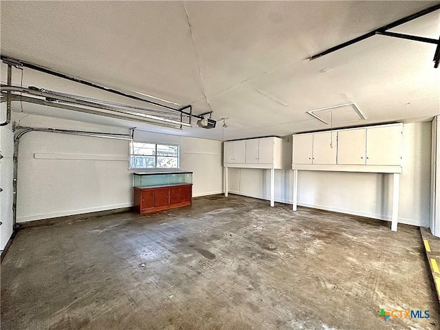 203 Hampshire St, Victoria, TX 77904 - garage with a garage door opener and baseboards