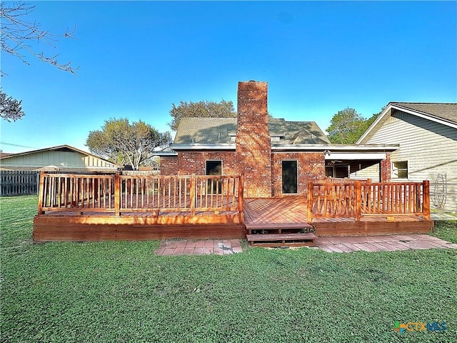 203 Hampshire St, Victoria, TX 77904 - rear view of property featuring brick siding, a chimney, and a wooden deck