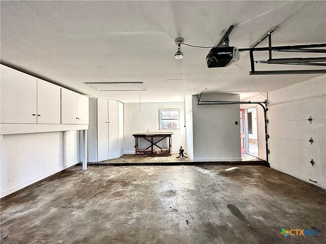 203 Hampshire St, Victoria, TX 77904 - garage featuring a garage door opener