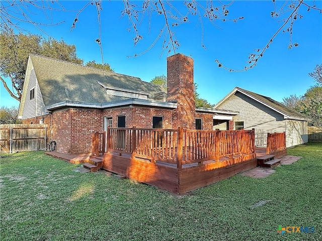 203 Hampshire St, Victoria, TX 77904 - rear view of house featuring a chimney, brick siding, a deck, and roof with shingles