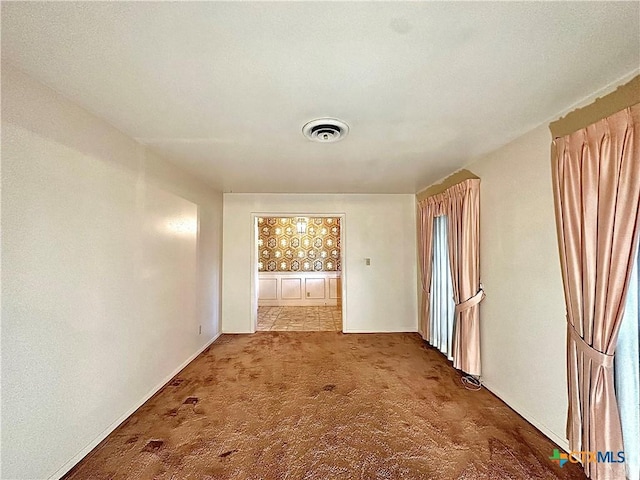 203 Hampshire St, Victoria, TX 77904 - corridor featuring carpet floors and baseboards