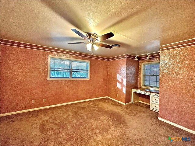 203 Hampshire St, Victoria, TX 77904 - unfurnished bedroom featuring a textured ceiling, carpet flooring, baseboards, ornamental molding, and ceiling fan
