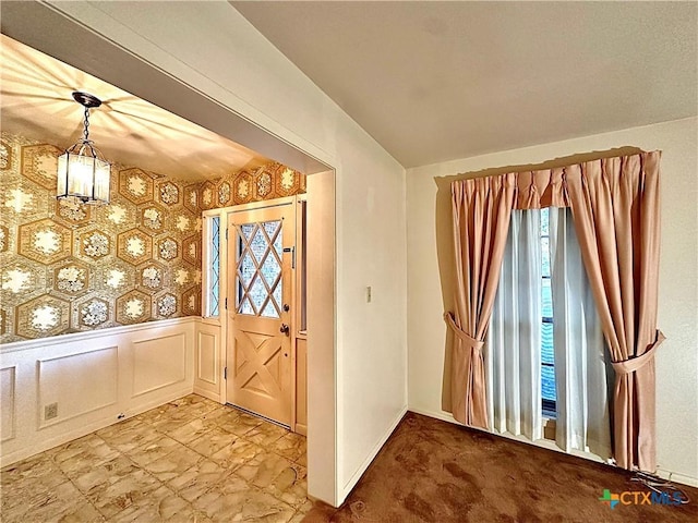 203 Hampshire St, Victoria, TX 77904 - entrance foyer featuring wallpapered walls, wainscoting, and baseboards