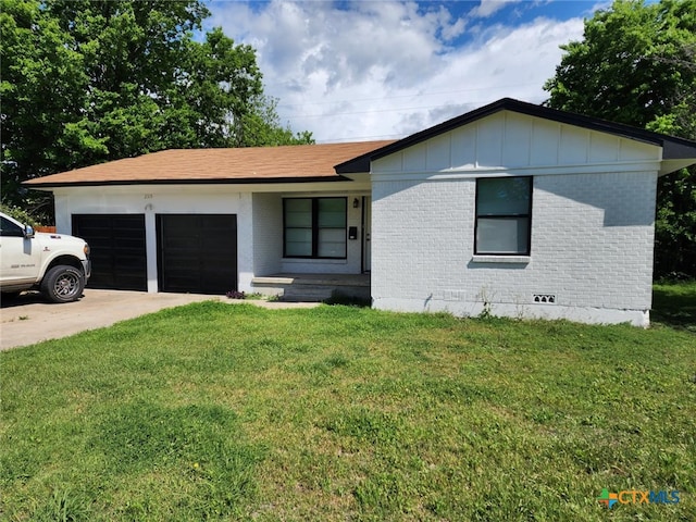 single story home featuring a front yard and a garage