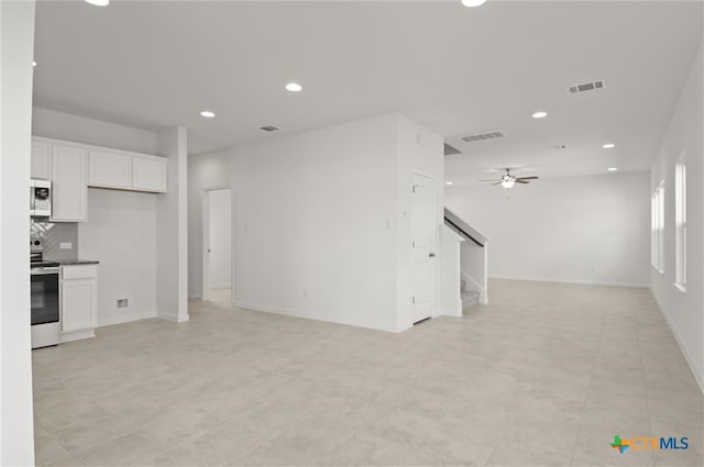 unfurnished living room featuring ceiling fan