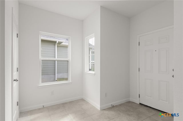 entrance foyer featuring light tile patterned floors