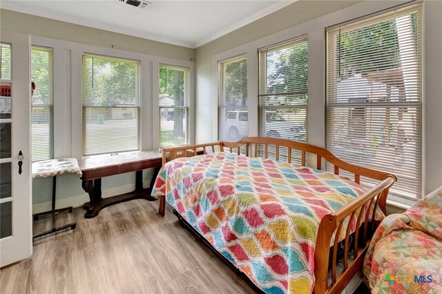 304 W Putnam, Ganado, TX 77962 - bedroom featuring wood finished floors and ornamental molding