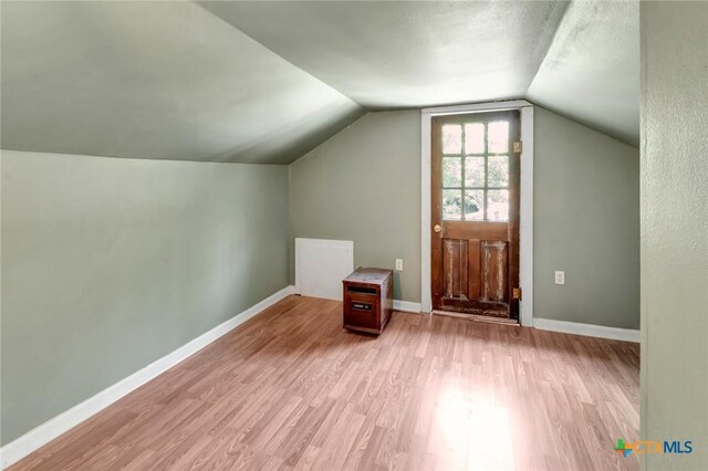 304 W Putnam, Ganado, TX 77962 - bonus room featuring light wood-style flooring, vaulted ceiling, and baseboards