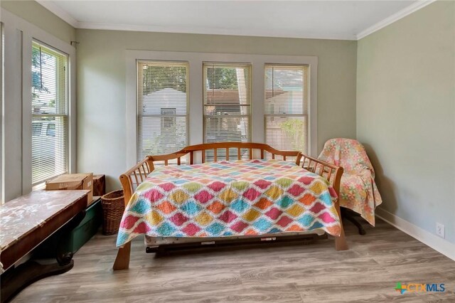 304 W Putnam, Ganado, TX 77962 - dining room with crown molding, wood finished floors, and baseboards