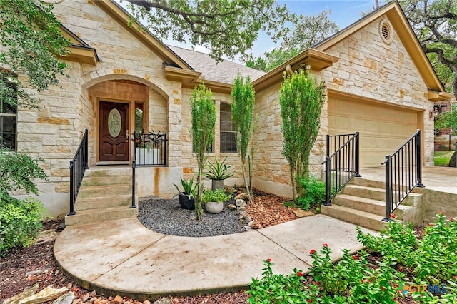 doorway to property with a garage