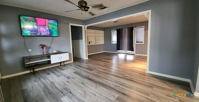 unfurnished living room with hardwood / wood-style floors and ceiling fan