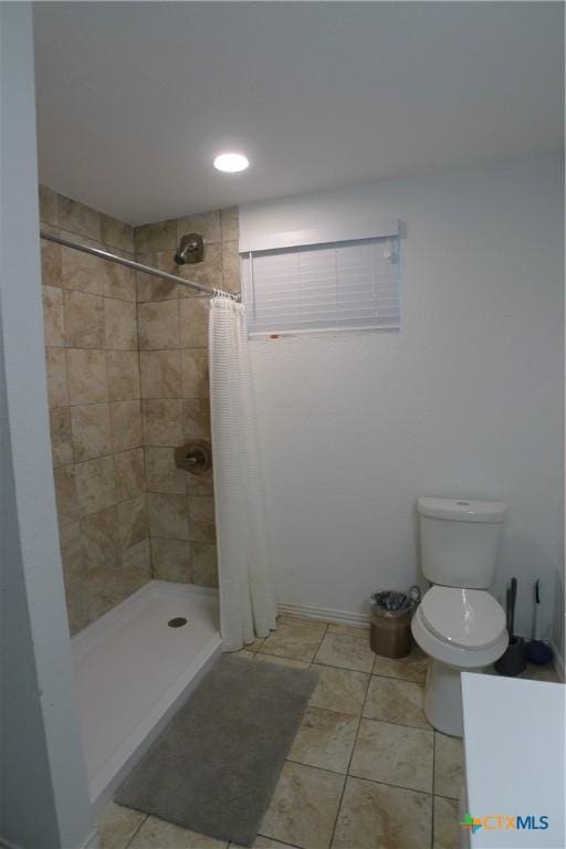 747 Oasis St, New Braunfels, TX 78130 - bathroom with a shower stall, toilet, and tile patterned flooring