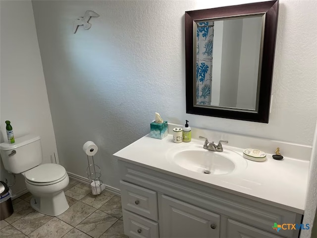 747 Oasis St, New Braunfels, TX 78130 - bathroom featuring toilet, vanity, and baseboards