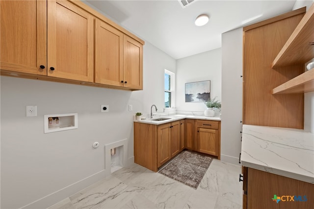 washroom featuring cabinets, hookup for a gas dryer, sink, washer hookup, and hookup for an electric dryer