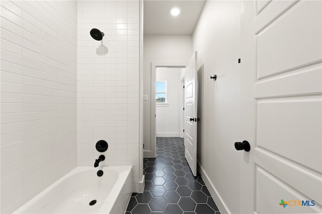 bathroom with tile patterned floors and tiled shower / bath