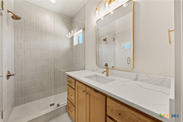 bathroom featuring vanity and walk in shower