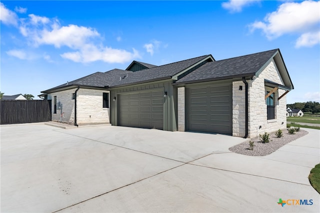 view of side of property featuring a garage