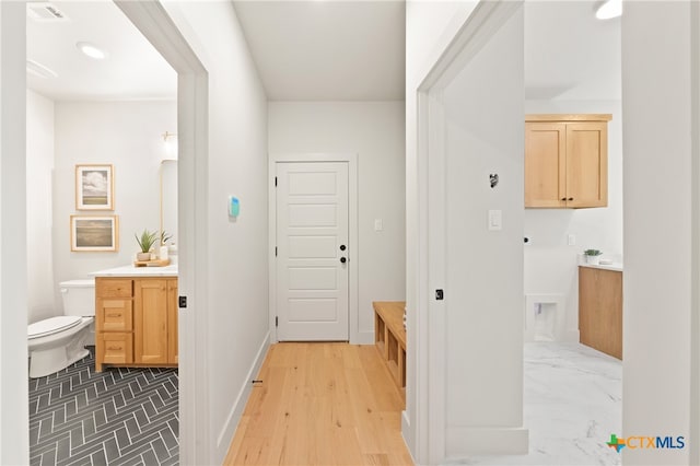 bathroom featuring hardwood / wood-style floors, vanity, and toilet