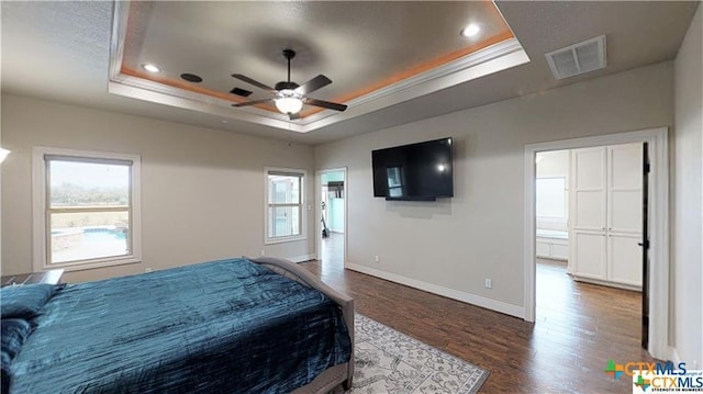 158 Sendera Loop, Victoria, TX 77904 - bedroom with a raised ceiling, dark wood finished floors, baseboards, ornamental molding, and recessed lighting