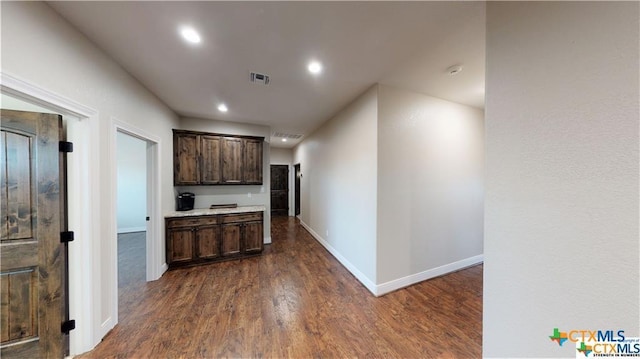 158 Sendera Loop, Victoria, TX 77904 - kitchen featuring dark wood-type flooring, dark brown cabinets, recessed lighting, baseboards, and light countertops