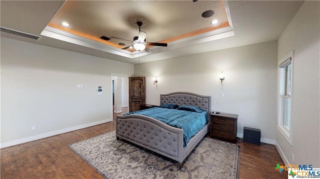 158 Sendera Loop, Victoria, TX 77904 - bedroom featuring a tray ceiling, wood finished floors, baseboards, and recessed lighting