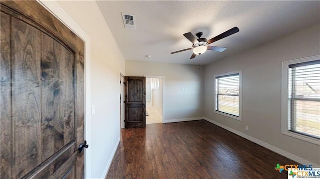 158 Sendera Loop, Victoria, TX 77904 - unfurnished room featuring wood finished floors, a ceiling fan, and baseboards