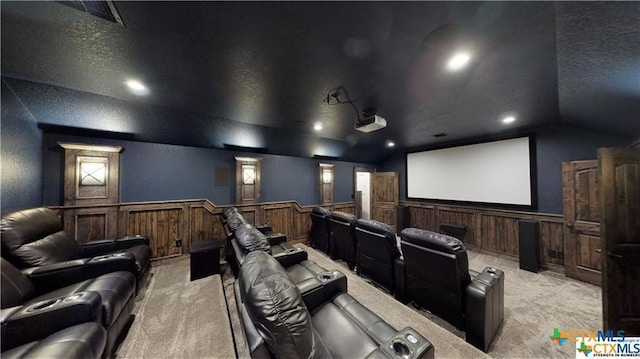 158 Sendera Loop, Victoria, TX 77904 - cinema room featuring light carpet, lofted ceiling, wainscoting, a textured ceiling, and recessed lighting