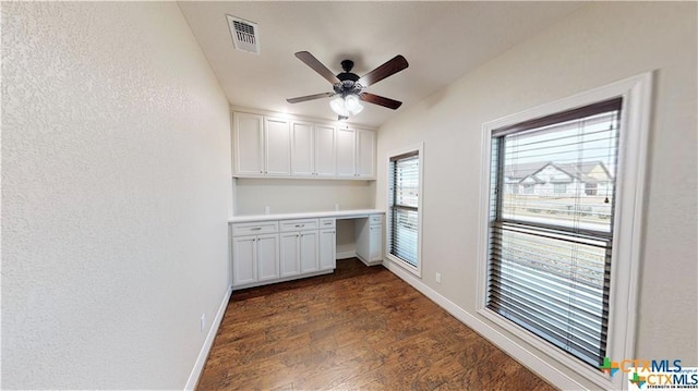 158 Sendera Loop, Victoria, TX 77904 - clothes washing area featuring dark wood finished floors, ceiling fan, baseboards, and a textured wall