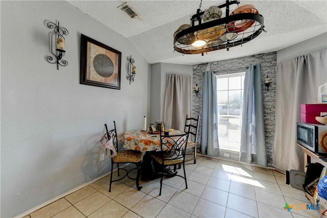 2201 Tracey Ann Ln, Killeen, TX 76543 - dining space featuring a textured ceiling and light tile patterned floors