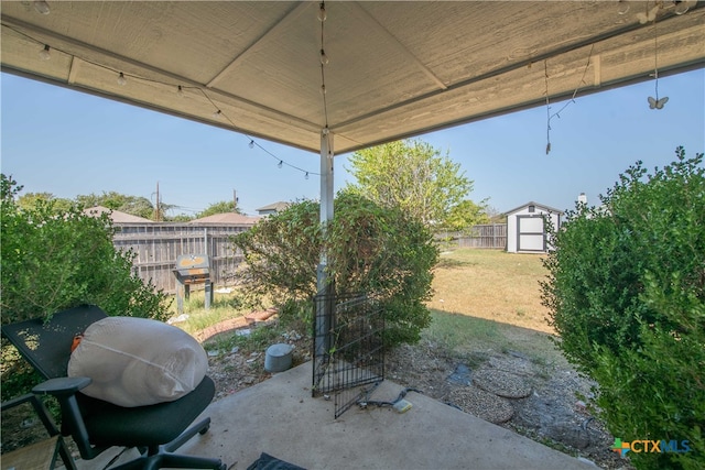 view of patio / terrace featuring a storage unit