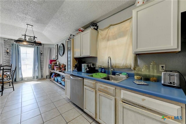 2201 Tracey Ann Ln, Killeen, TX 76543 - kitchen with dishwasher, a sink, light tile patterned floors, a textured ceiling, and decorative light fixtures