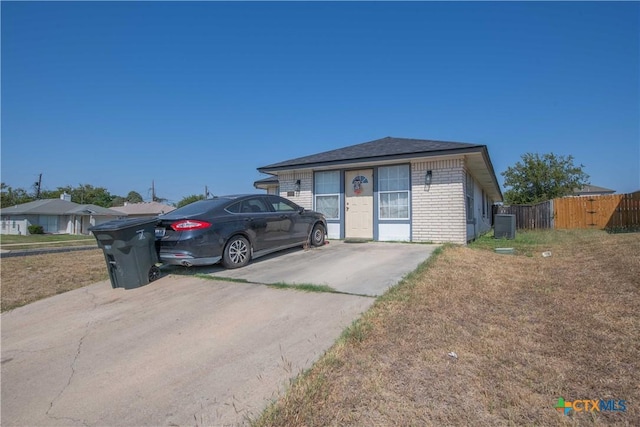 2201 Tracey Ann Ln, Killeen, TX 76543 - view of front facade with brick siding and central AC unit