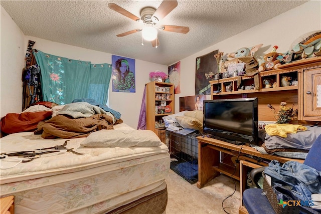 carpeted bedroom featuring ceiling fan and a textured ceiling