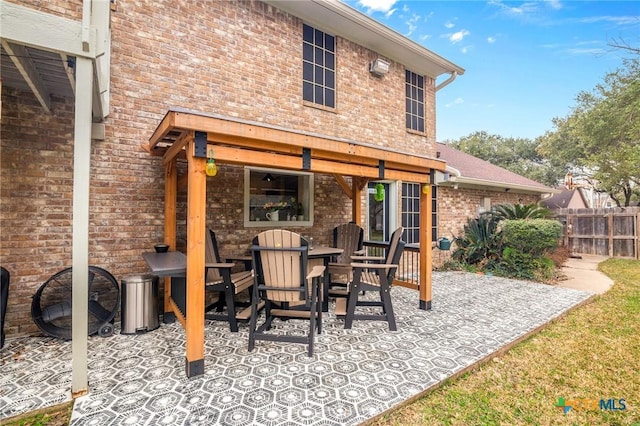 view of patio featuring fence