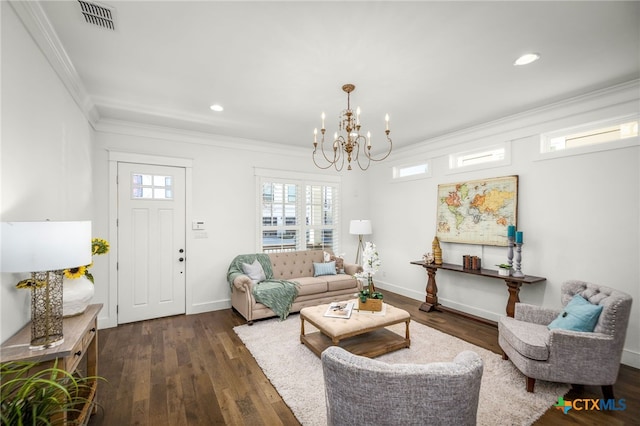 living room with baseboards, visible vents, ornamental molding, dark wood-type flooring, and a chandelier