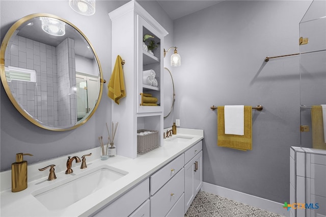 bathroom with tile patterned flooring, vanity, and tiled shower