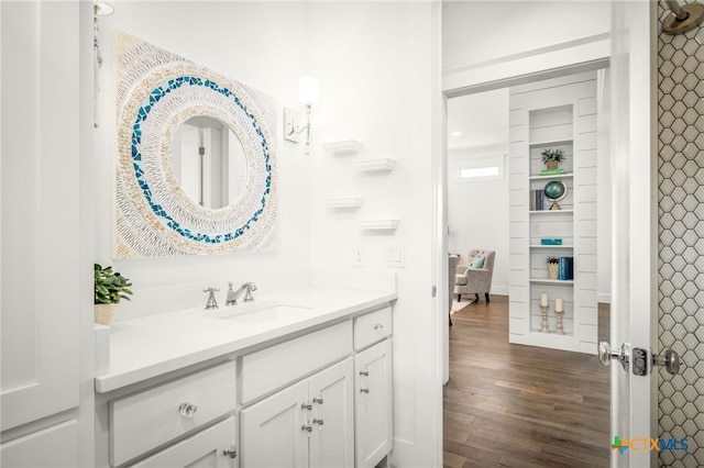 bathroom with vanity and wood finished floors