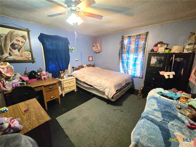 carpeted bedroom with a textured ceiling and ceiling fan