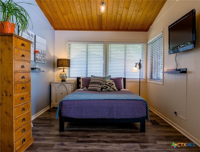 bedroom featuring dark hardwood / wood-style floors, wood ceiling, and lofted ceiling