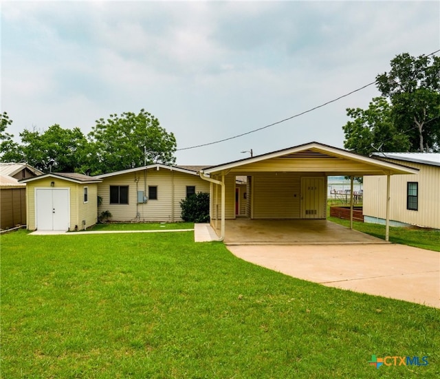 ranch-style house featuring a carport and a front yard