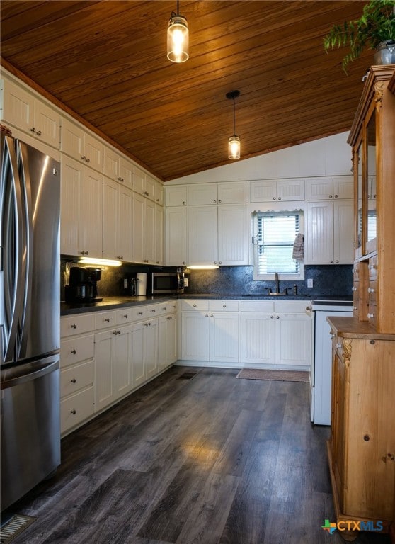 kitchen with stainless steel appliances, lofted ceiling, white cabinets, pendant lighting, and dark hardwood / wood-style flooring