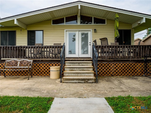 doorway to property featuring a deck