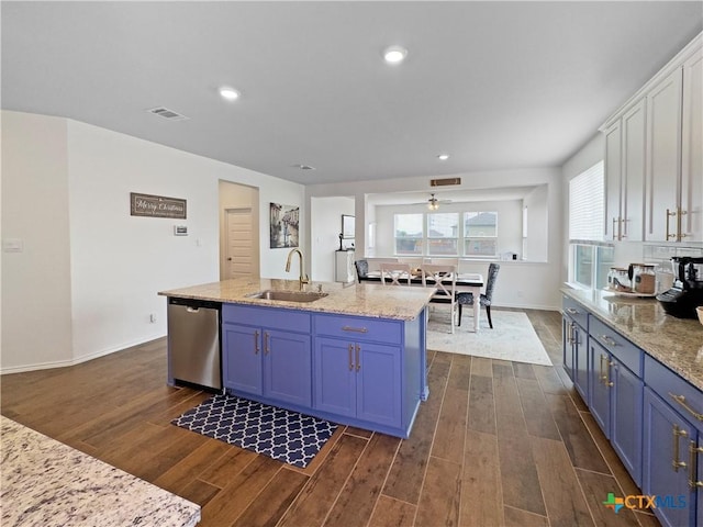327 Steele Way, Cibolo, TX 78108 - kitchen featuring stainless steel dishwasher, a sink, blue cabinets, dark wood finished floors, and recessed lighting