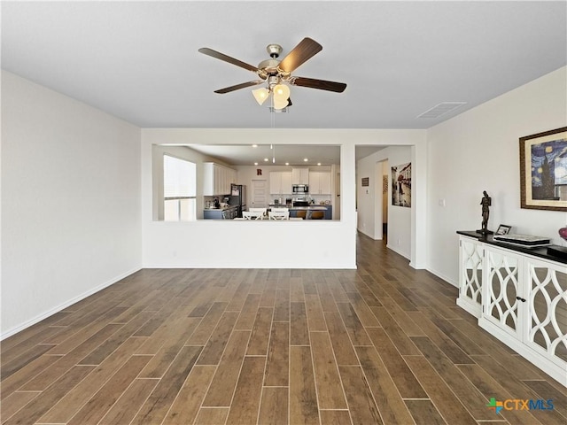 327 Steele Way, Cibolo, TX 78108 - unfurnished living room featuring dark wood-style floors, ceiling fan, and baseboards